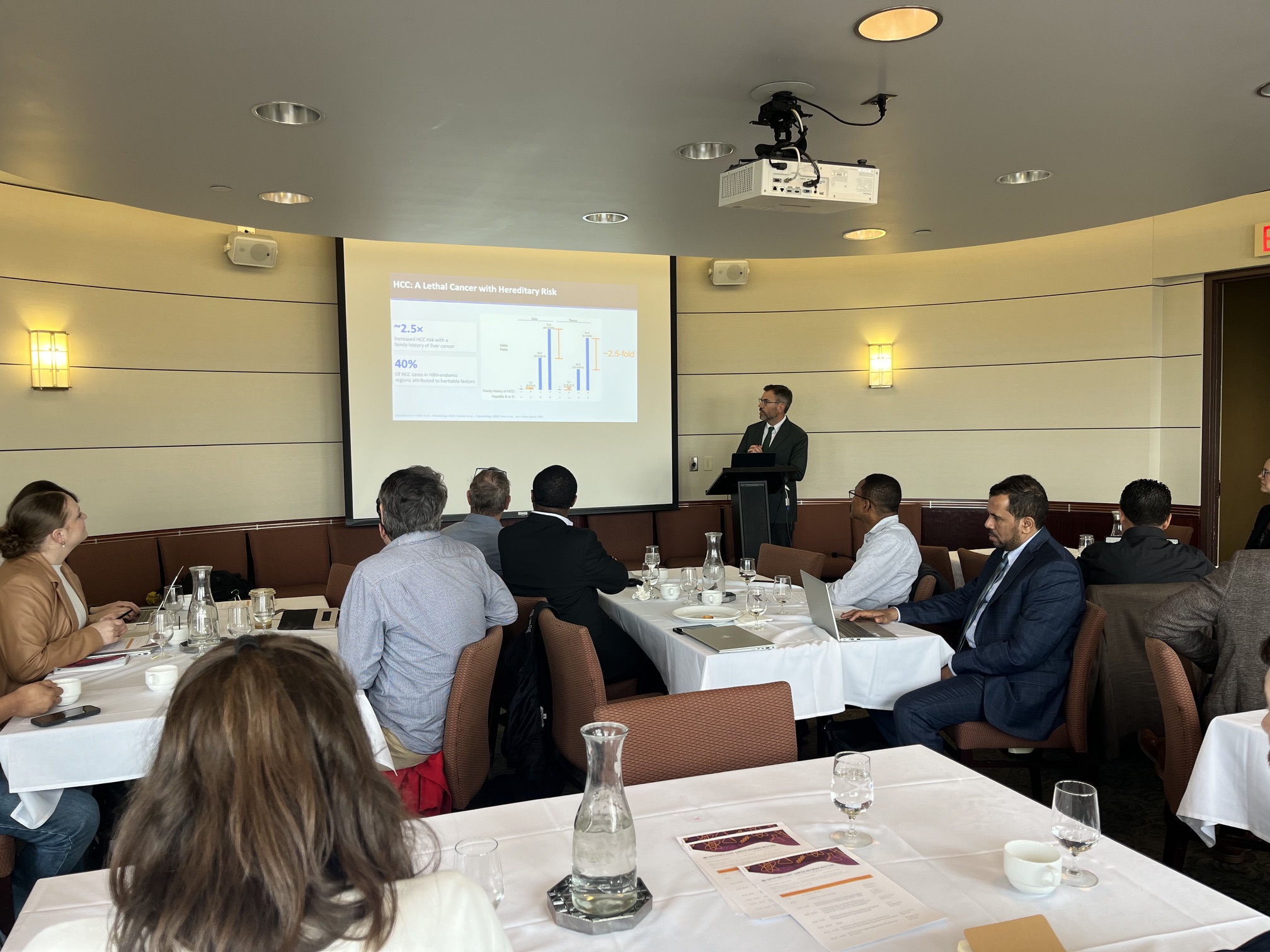 Image from the audience of presenter at Symposium